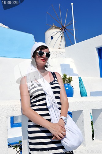 Image of Greek woman on the streets of Oia, Santorini, Greece