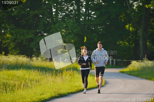 Image of Young couple jogging