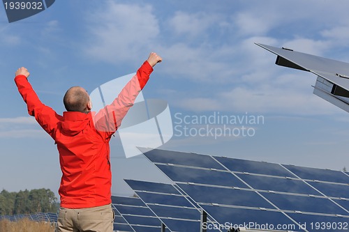 Image of Male solar panel engineer at work place