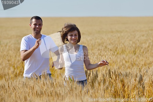Image of happy couple in wheat field