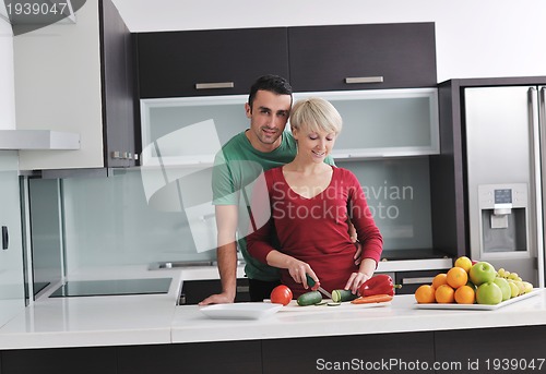 Image of young couple have fun in modern kitchen