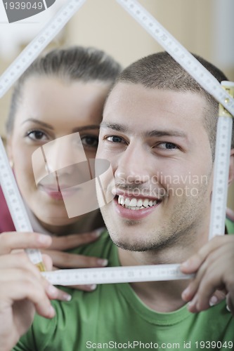 Image of Young couple moving in new home