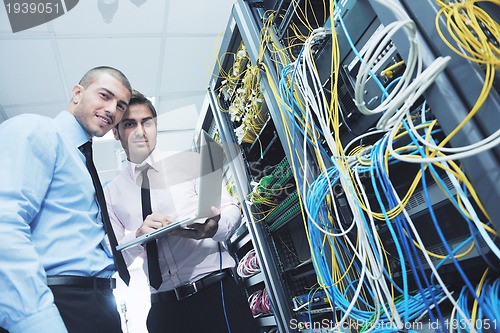 Image of it enineers in network server room