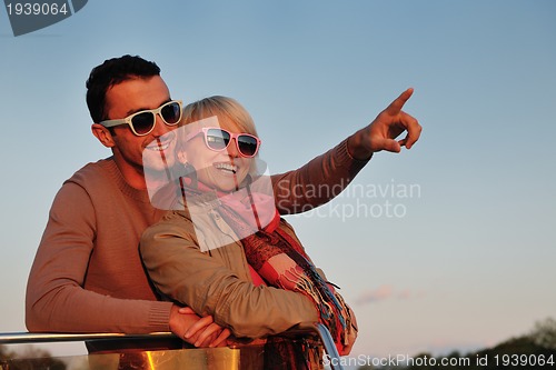 Image of couple in love  have romantic time on boat