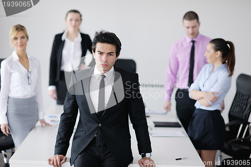 Image of young business man at meeting