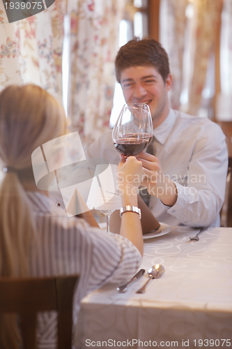 Image of young couple having dinner at a restaurant