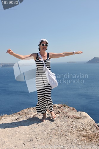 Image of Greek woman on the streets of Oia, Santorini, Greece