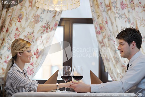 Image of young couple having dinner at a restaurant