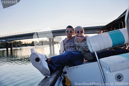 Image of couple in love  have romantic time on boat