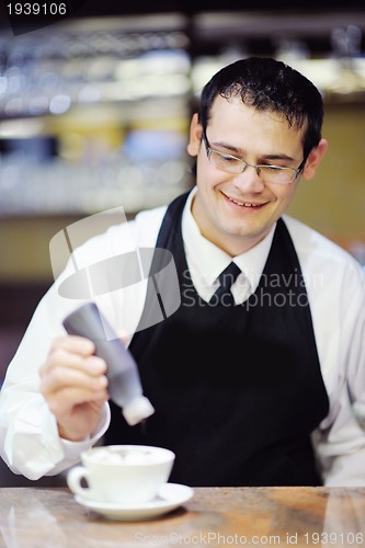 Image of Barista prepares cappuccino