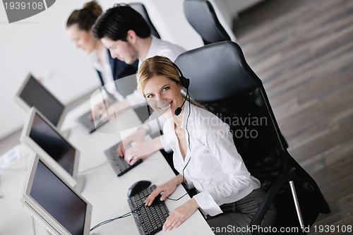 Image of business people group working in customer and helpdesk office