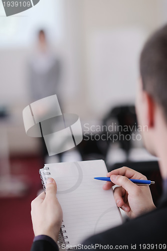 Image of business man on seminar