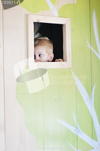 Image of happy child in a window