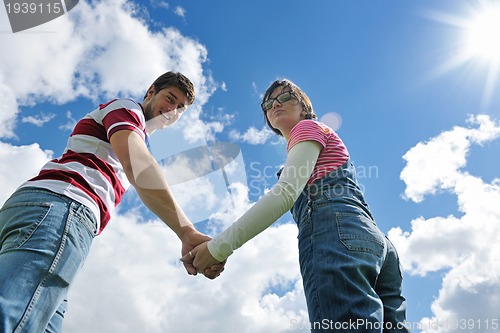 Image of romantic young couple in love together outdoor