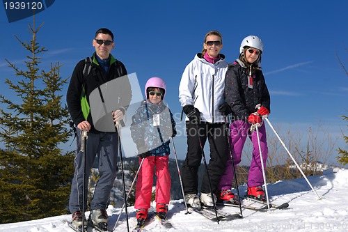 Image of portrait of happy young family at winter