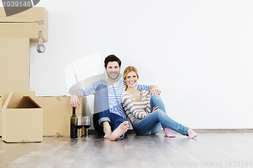 Image of Young couple moving in new house