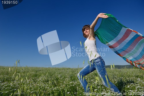 Image of young woman in wheat field at summer
