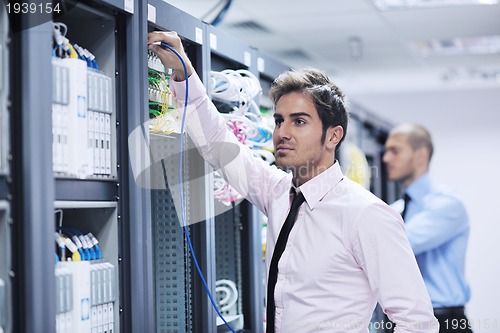 Image of it enineers in network server room