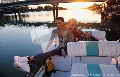 Image of couple in love  have romantic time on boat