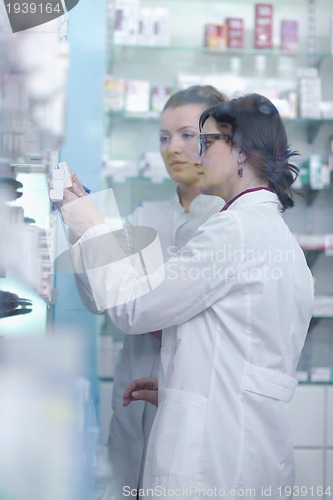 Image of team of pharmacist chemist woman  in pharmacy drugstore