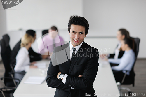 Image of young business man at meeting