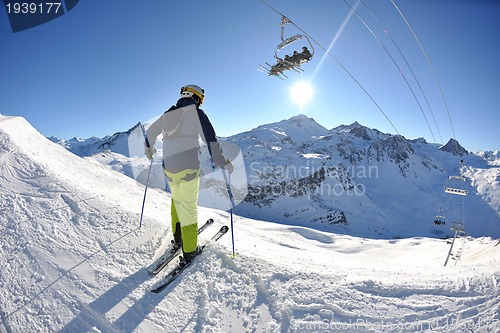 Image of skiing on fresh snow at winter season at beautiful sunny day