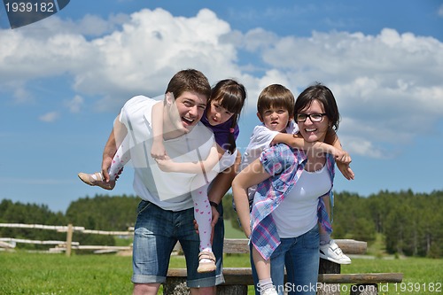 Image of happy young family have fun outdoors