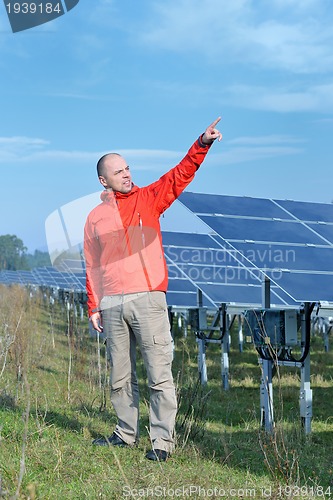 Image of Male solar panel engineer at work place