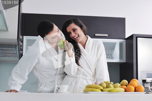 Image of young couple have fun in modern kitchen