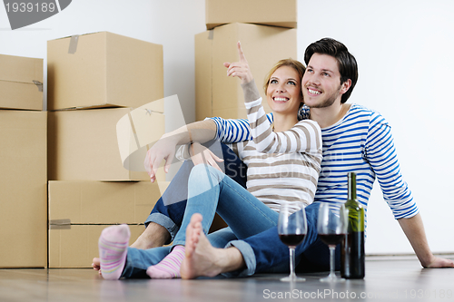 Image of Young couple moving in new house