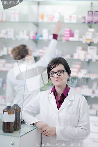 Image of team of pharmacist chemist woman  in pharmacy drugstore