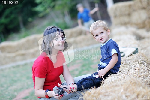 Image of woman and child have fun outdoor