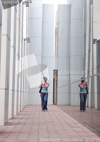 Image of beautiful young woman in the city