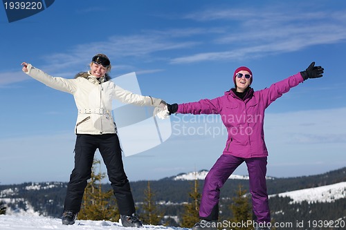 Image of winter season fun with group of girls