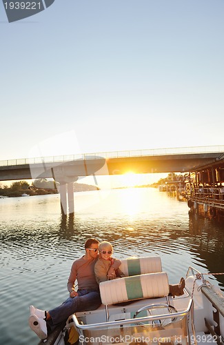 Image of couple in love  have romantic time on boat