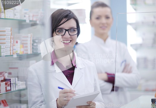 Image of team of pharmacist chemist woman  in pharmacy drugstore