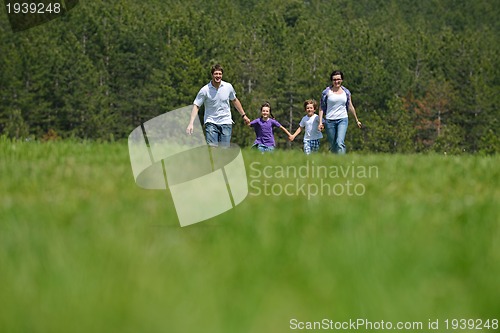 Image of happy young family have fun outdoors