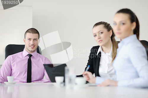 Image of Group of young business people at meeting