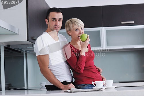 Image of young couple have fun in modern kitchen
