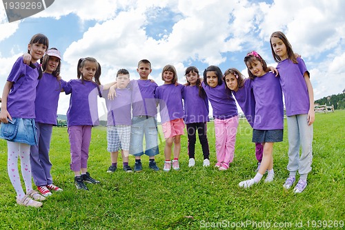 Image of happy kids group  have fun in nature