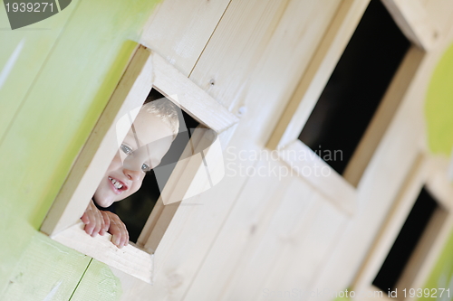 Image of happy child in a window