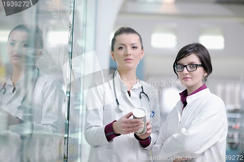 Image of team of pharmacist chemist woman  in pharmacy drugstore