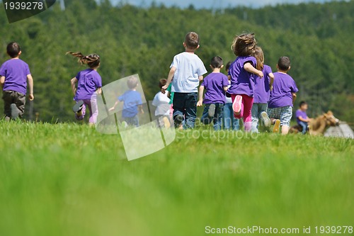 Image of happy kids group  have fun in nature