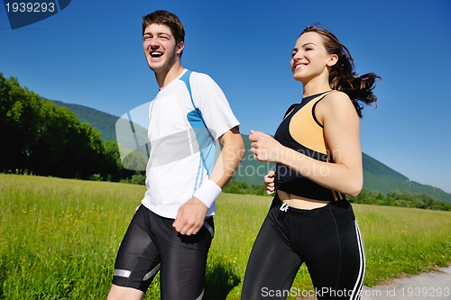 Image of Young couple jogging