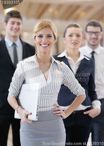 Image of business woman standing with her staff at conference
