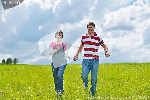 Image of romantic young couple in love together outdoor