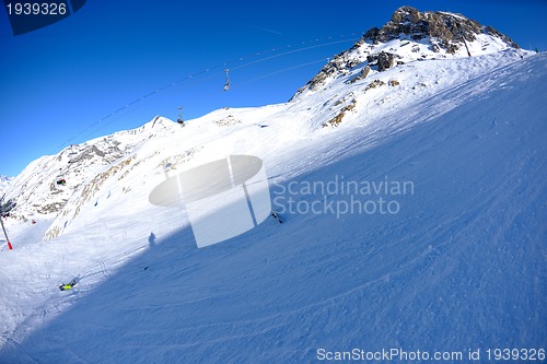 Image of skiing on fresh snow at winter season at beautiful sunny day