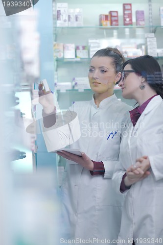 Image of team of pharmacist chemist woman  in pharmacy drugstore