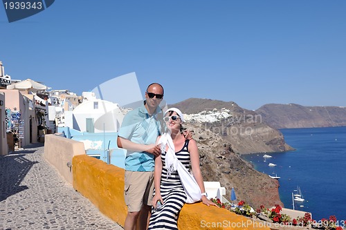 Image of happy young couple tourists in greece