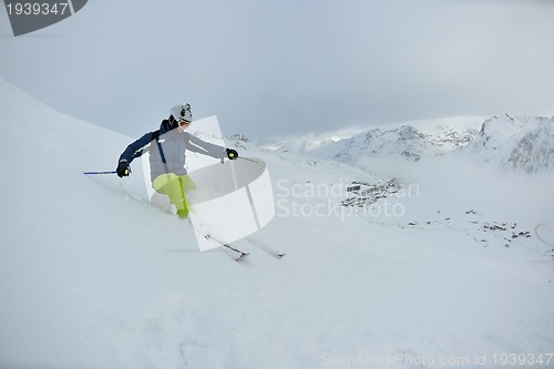 Image of skiing on fresh snow at winter season at beautiful sunny day